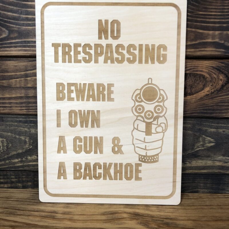 I OWN A GUN AND A BACKHOE